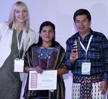 Ugne Lipeikaite of EIFL presents an Innovation Award for Using ICT to empower women to Rija’tzuul Na’ooj Library (Guatemala), represented by Petrona Garcia Hernandez and Rodolfo Antonio Perez Yperez, mayor of San Juan la Laguna. Ugne Lipeikaite of EIFL presents an Innovation Award for Using ICT to empower women to Rija’tzuul Na’ooj Library (Guatemala), represented by Petrona Garcia Hernandez and Rodolfo Antonio Perez Yperez, mayor of San Juan la Laguna.