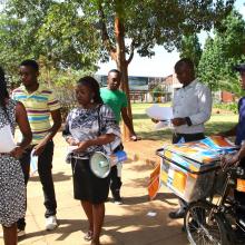 Student open access campaigners at Harare Institute of Technology used a megaphone to broadcast messages and a bicycle to distribute pamphlets during Open Access Week 2015. Photo by Jasper Lee Maenzanise.