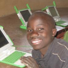 Children using laptop computers in the library. 