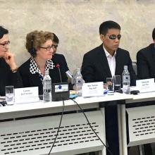 Speakers at the seminar table.