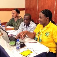 Three Zambian librarians at training, learning about ICT.