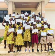 Students at Volta Regional Library holding up their certificates. 