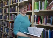 Photo of Barbara Szczepanska in the library at Hogan Lovells