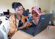 two young women learning ICT during Maendeleo Foundation workshop.