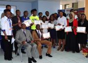 A group of learners holding certificates. 