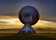 Satellite dish depicting broadcasting, in the sunset.