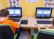 Two children learning digital and financial skills on computers In Prelog City Public Library.