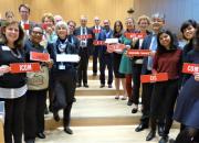 Representatives from the library, archive, museum and education sectors at SCCR/37. They are in the hall, holding names to identify organisations.