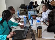 Kenyan public librarians working on media literacy presentation practice.