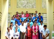 group photo of participants standing on stairs