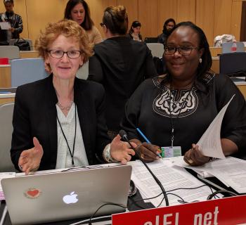 Teresa Hackett, EIFL Copyright and Libraries Programme Manager and Awa Cissé, EIFL copyright librarian in Senegal working together at EIFL's desk at WIPO's copyright committee meeting. 