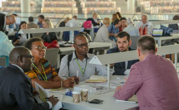 EIFL coordinators (librarians) talking to EIFL partner publishers at the 2018 General Assembly