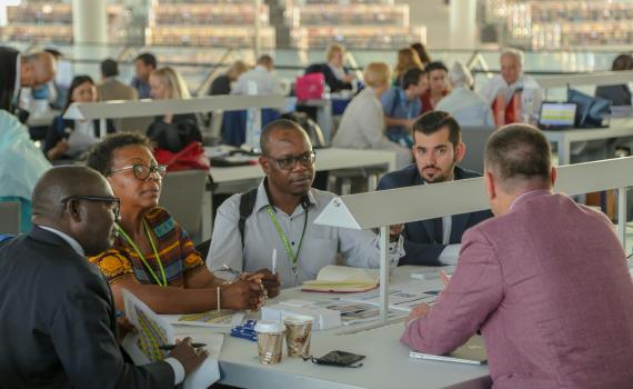 EIFL coordinators (librarians) talking to EIFL partner publishers at the 2018 General Assembly 