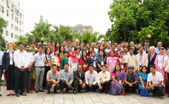 Group photo of seminar participants in the grounds of Hotel Shanker