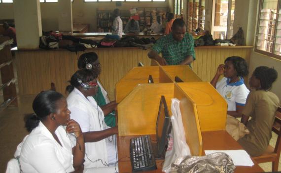 Health workers learn to use computers in Northern Regional Library's maternal health corner.