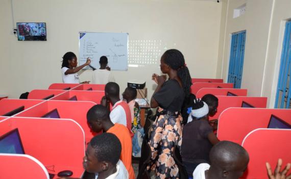 ICT training in a new computer lab in Koboko Public Library. Each learner has a computer terminals in cubicles.