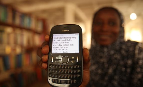 Women received advice and encouragement through the simplest of devices — their mobile phones. Photo credit: Iain Marlow Women received advice and encouragement through the simplest of devices — their mobile phones. Photo credit: Iain Marlow
