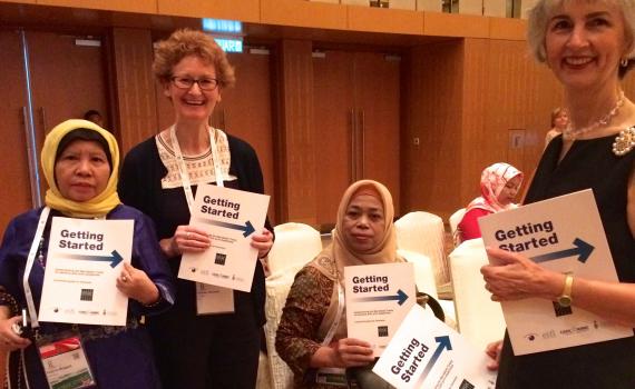 Teresa Hackett, EIFL Copyright and Libraries Programme Manager and Victoria Owen, University of Toronto Scarborough share copies of the new Marrakesh Treaty guide launched at IFLA WLIC 2018 in Kuala Lumpur.