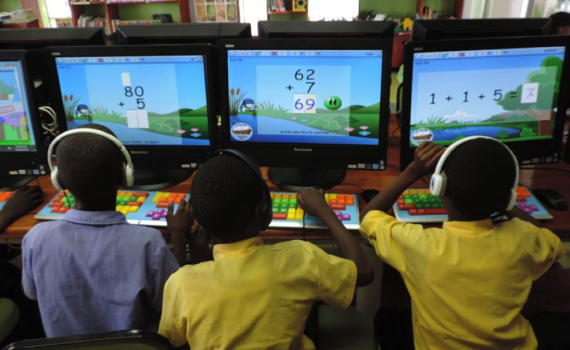 Ohangwena Regional Library, northern Namibia Three children using computers with maths software to practice their maths.