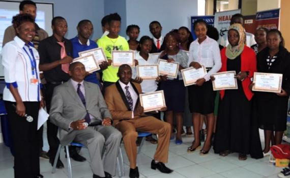 A group of learners holding certificates. 