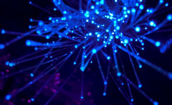 Abstract image representing sharing of scientific research - blue lights, connected.