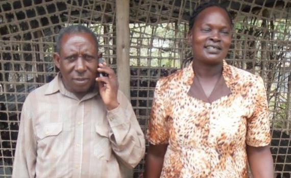 Two poultry farmers - a husband and wife team - at their farm.