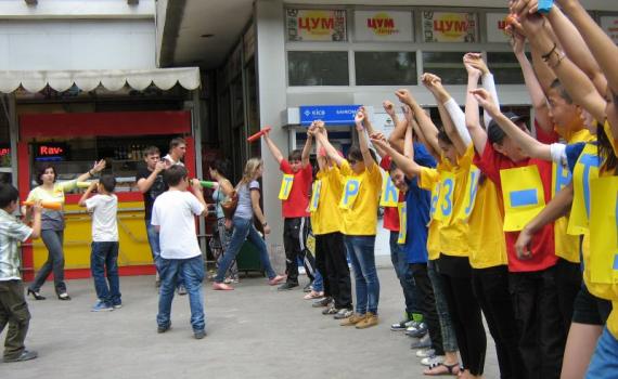 Young people taking part in a 'No to TB!' flash mob in the town shopping area.