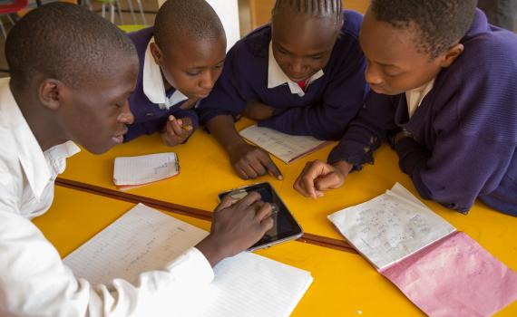 Children use tablet computers to access educational content linked to the school curriculum in Kibera Public Library.