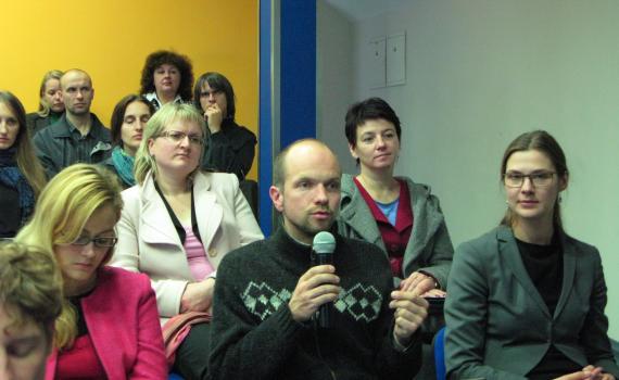 A group of researchers and scientists promoting open access at a meeting. 