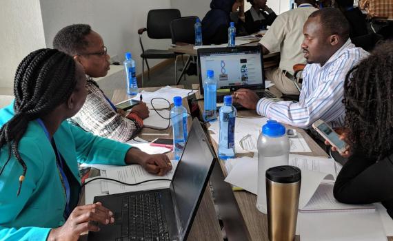 Kenyan public librarians working on media literacy presentation practice.