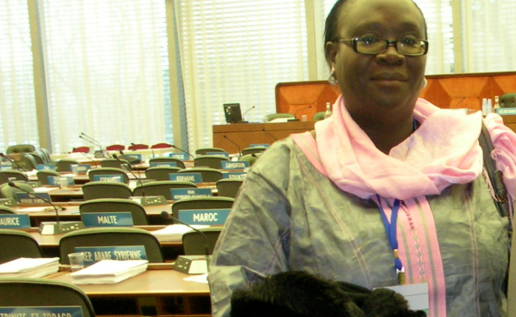 Awa Diouf Cissé in the picture standing in front of the conference room